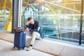 Man upset, sad and angry at the airport his flight is delayed Royalty Free Stock Photo