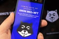 Man use Anon Inu NFT crypto currency, hacker anonymous digital money concept, logo close-up