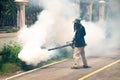 Man use fumigation mosquitoes machine for kill mosquito carrier of Zika and dengue fever around the house