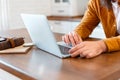 Man use laptop for online work education or shopping. Close up Male Hands Young man working from home at laptop in Royalty Free Stock Photo