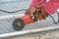 Man used angle grinder without cover guard cutting metal net