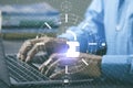 A man uses a computer placed on his desk to do his work Royalty Free Stock Photo