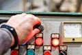The man uses the control panel from the CNC machine, which gives the command to process the part Royalty Free Stock Photo