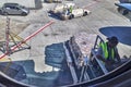 Male airport ground crew loading airplane as seen from passenger inside view Royalty Free Stock Photo