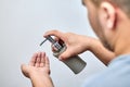 A man uses a dispenser with liquid soap. Applies to hand skin for prophylaxis against viral infection COVID-19. Personal body hygi Royalty Free Stock Photo