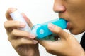 Man uses an inhaler Royalty Free Stock Photo