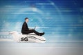 Man uses laptop on plane with 5G network symbol Royalty Free Stock Photo