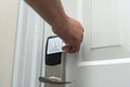 A man uses a magnetic stripe cards to gain access to his hotel room. A guest opening the door to his suite with his key card