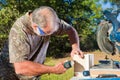 Man Uses a Nail Gun