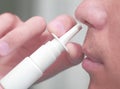 Man uses a nasal spray Royalty Free Stock Photo