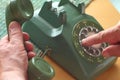 Man uses old rotary phone