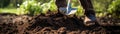 Man Uses Pitchfork To Aerate The Compost Pile Panoramic Banner