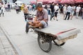 Man uses a smartphone while on Panjiayuan Antique Market, Beijing