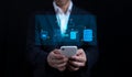 Man uses a smartphone to see a virtual screen. cloud computing. storing of data. Concept of internet services and networking. DMS Royalty Free Stock Photo