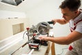 the man uses special tool for cut of boards