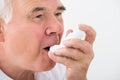 Man Using Asthma Inhaler Royalty Free Stock Photo