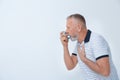 Man using asthma inhaler Royalty Free Stock Photo