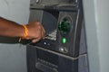 Man using ATM machine to withdraw his money. closeup of hand entering PIN or pass code on ATM machine keypad,security code on Royalty Free Stock Photo