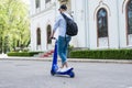 Man using blue electric scooter in the park