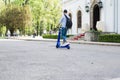 Man using blue electric scooter in the park