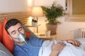 Man using breathing mask in bed Royalty Free Stock Photo