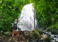 Man using camera on hiking trip in the mountains. Royalty Free Stock Photo