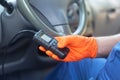 Auto mechanic using car diagnostic scan tool Royalty Free Stock Photo