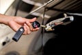 A man using a car key to open a car. Royalty Free Stock Photo