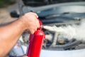 Man using car to extinguish a car fire. Royalty Free Stock Photo