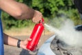 Man using car to extinguish a car fire Royalty Free Stock Photo
