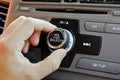 Man using car volume control. Royalty Free Stock Photo