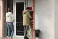 Man using cash machine for money withdrawal outdoors Royalty Free Stock Photo