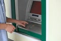 Man using cash machine for money withdrawal outdoors Royalty Free Stock Photo