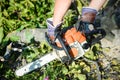 Man using chainsaw. closeup of his hands Royalty Free Stock Photo