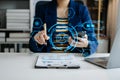 Businessman using chatbot in computer and tablet smart intelligence Ai.Chat with AI Artificial Intelligence, developed by OpenAI Royalty Free Stock Photo