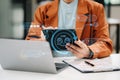 Man using chatbot in computer and tablet smart intelligence Ai.Chat with AI Artificial Intelligence, developed by OpenAI generate Royalty Free Stock Photo