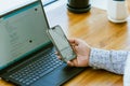 Man using ChatGPT in the mobile phone. This app is a chatbot based on Artificial Intelligence developed by OpenAI Royalty Free Stock Photo