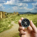 Man using a compass while sightseeing abroad Royalty Free Stock Photo