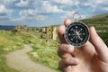 Man using a compass while sightseeing abroad Royalty Free Stock Photo
