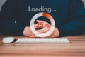 Man using a computer keyboard to download and waiting to loading digital business data form website. Royalty Free Stock Photo