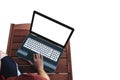 A man using computer lap top on wooden table, white empty computer screen, isolated on white background. Clipping path included Royalty Free Stock Photo