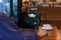 Man using computer mouse working on laptop at table in cafe. Royalty Free Stock Photo