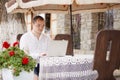 Man using a computer on an outdoor table Royalty Free Stock Photo