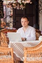 Man using a computer on an outdoor table Royalty Free Stock Photo