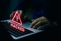 Man using computer with system hacked alert warning signs attack on computer network. Data Protection. Internet malware virus Royalty Free Stock Photo
