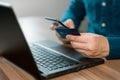 Man using credit card for purchasing and shopping online on mobile phone. Mobile payment with wallet app technology. Royalty Free Stock Photo