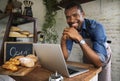 Man using devices for online business order at bakehouse Royalty Free Stock Photo