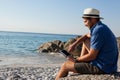 Man using digital tablet on the beach Royalty Free Stock Photo