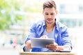 Man using digital tablet at cafe Royalty Free Stock Photo