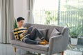 Man using digital tablet on sofa at home Royalty Free Stock Photo